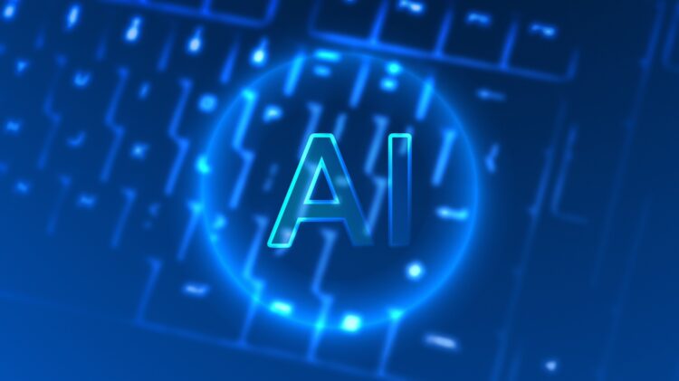 Na rozmytą klawiaturę nałożono świecący niebieski symbol „AI”, co oznacza technologię sztucznej inteligencji.
